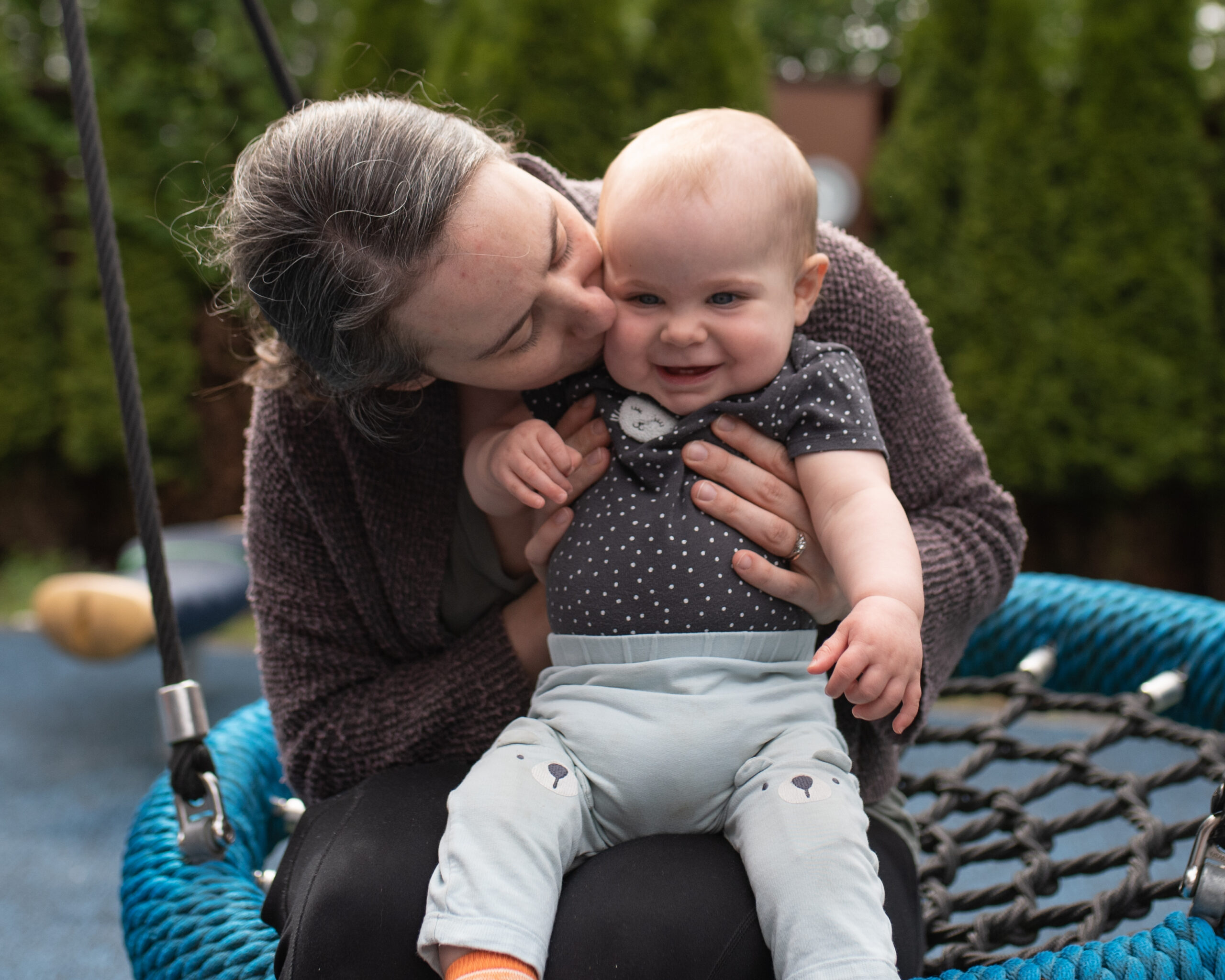 Mom and baby on swing